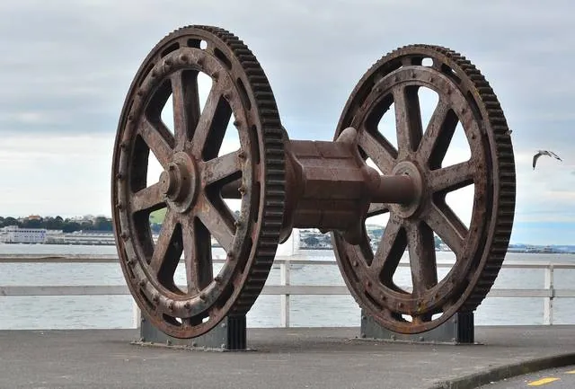 One of the two giant rusty cog wheels of the dredge Whakarire, close up, on the wharf at Wynyard Point